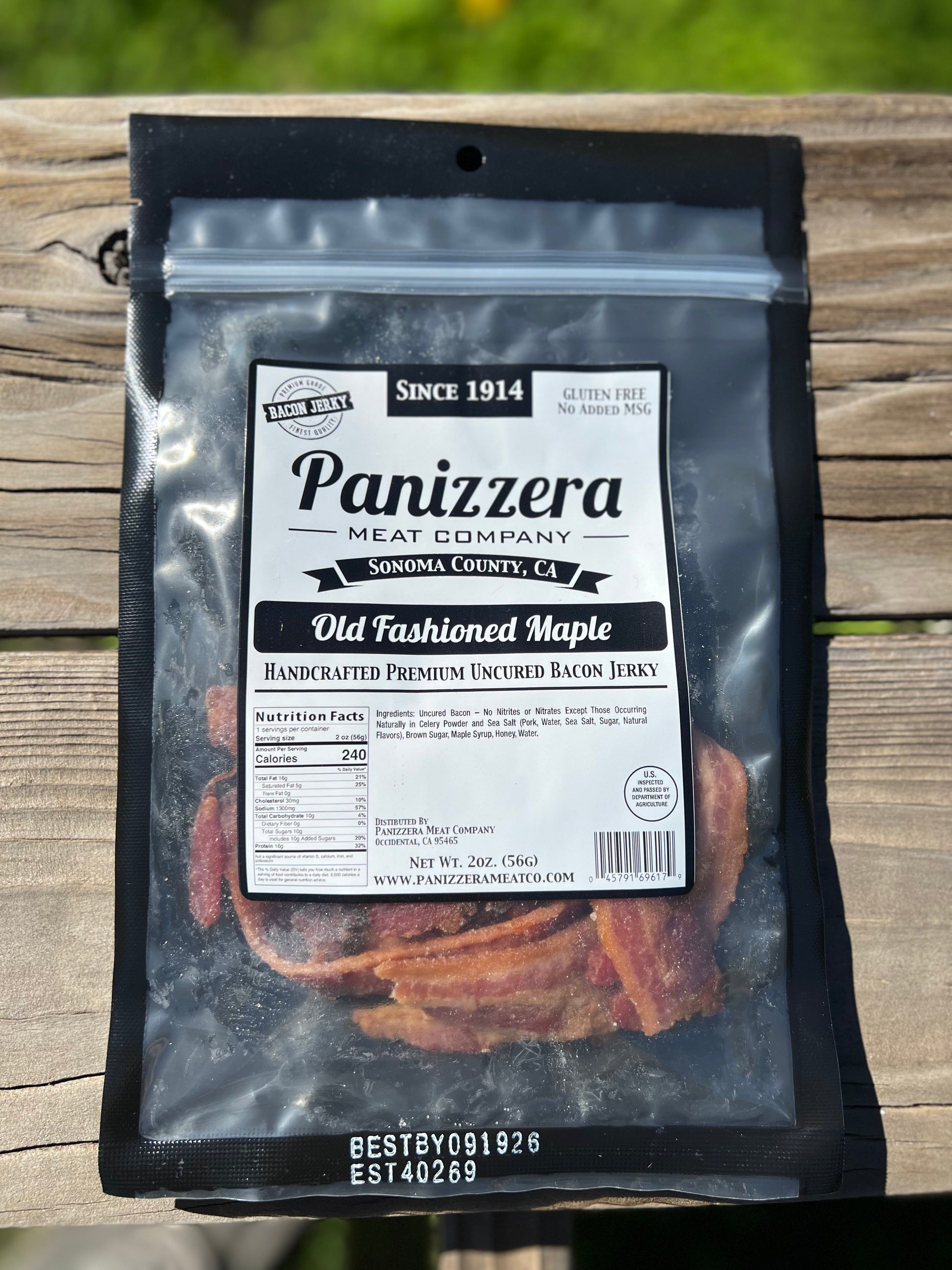 Panizzera Meat Company bacon jerky package on a wooden surface