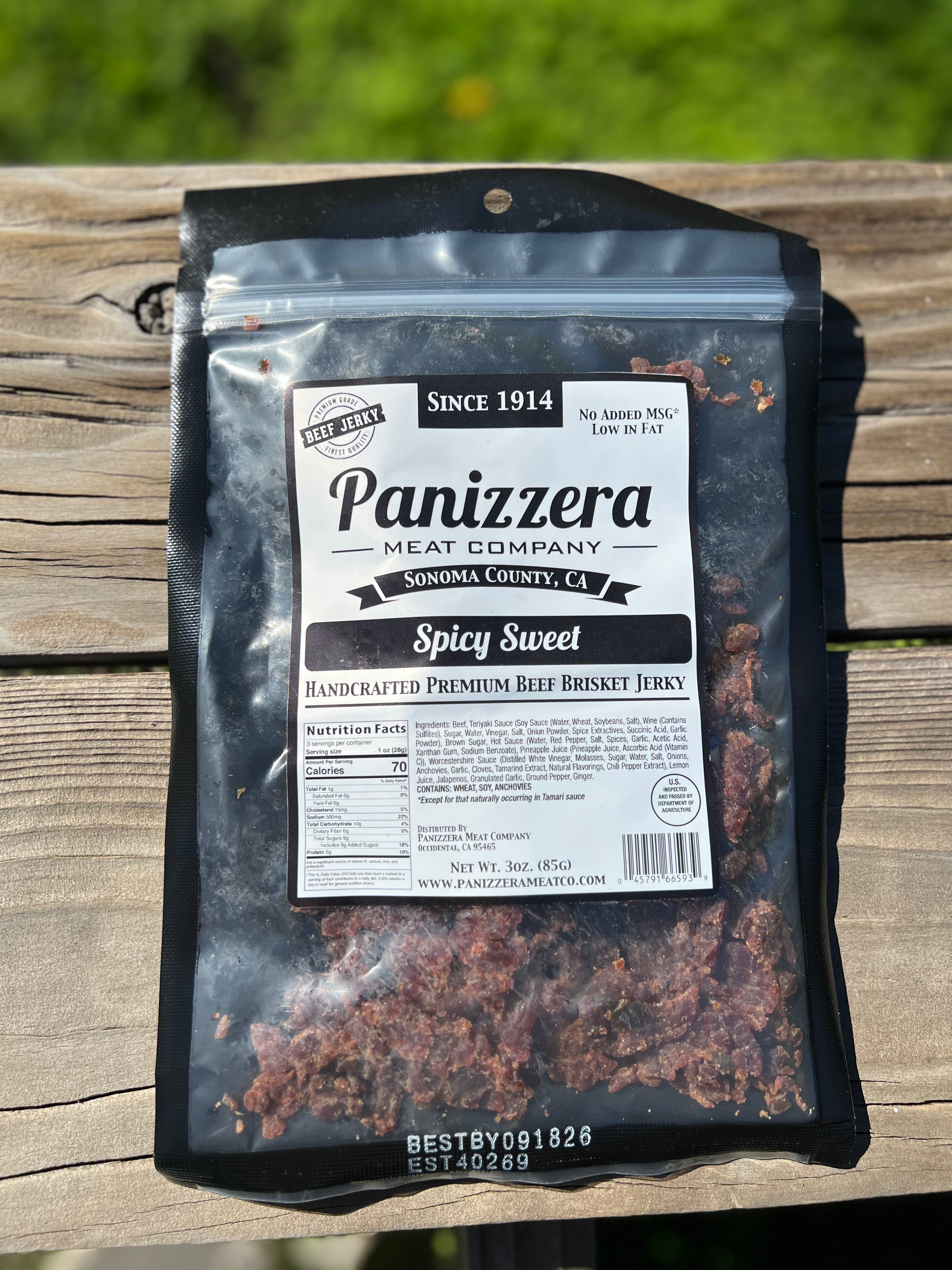 Panizzera Meat Company Spicy Sweet Beef Brisket Jerky package on a wooden surface