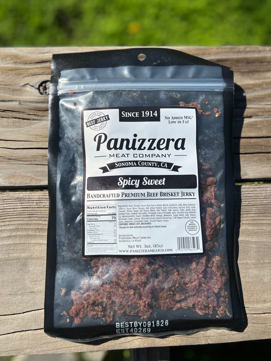 Panizzera Meat Company Spicy Sweet Beef Brisket Jerky package on a wooden surface
