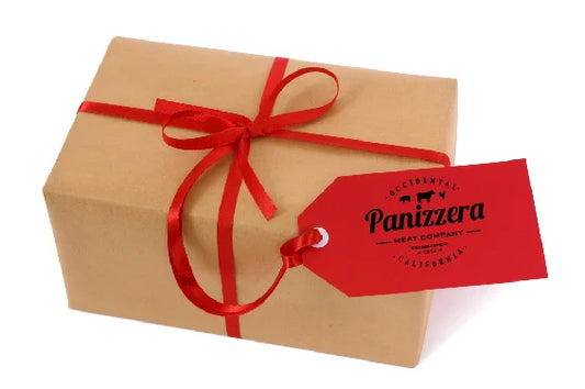 Gift box wrapped in brown paper with a red ribbon and Panizzera tag on a white background